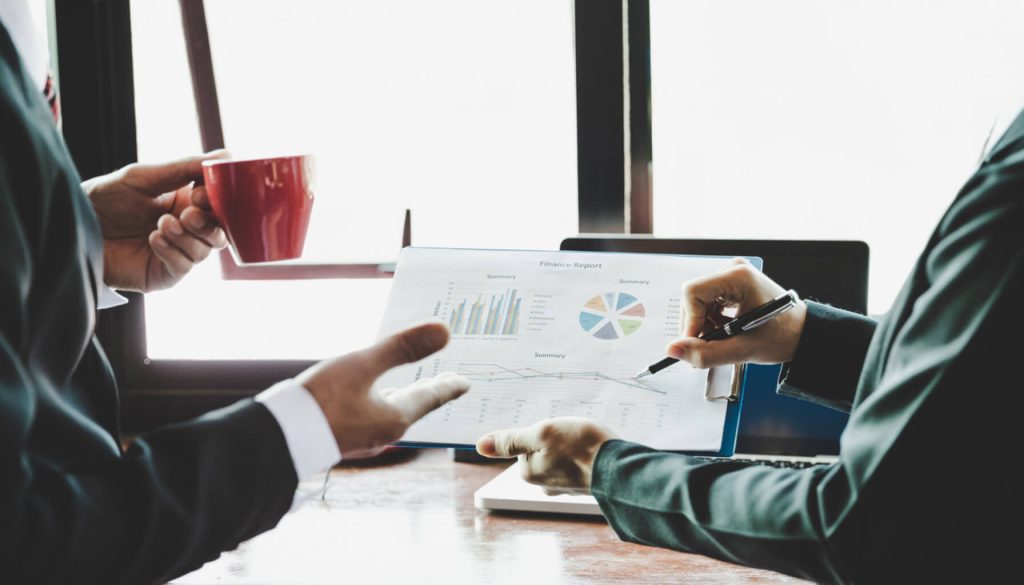 Business team analyzing income charts and graphs