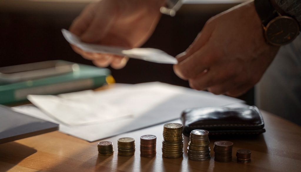 Close up on coins saved for energy crisis expenses